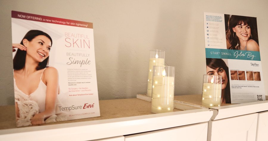 Countertop display with skincare and TempSure Envi promotional flyers